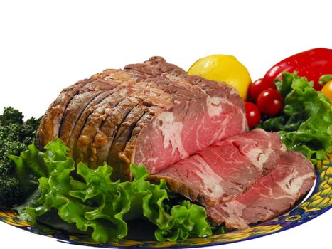 Knuckle ham with fresh salad, broccoli, lemon,California peppers on a plate with white background