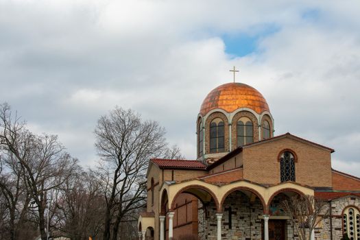 A Luxuruious Golden Temple in the Suburbs on a Cloudy Blue Sky