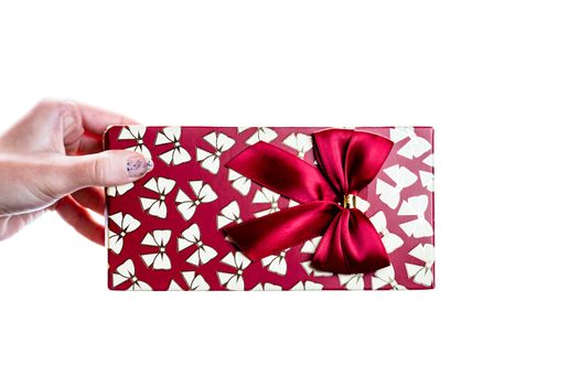 Hand showing holding giving or receiving gift present box isolated on white background.