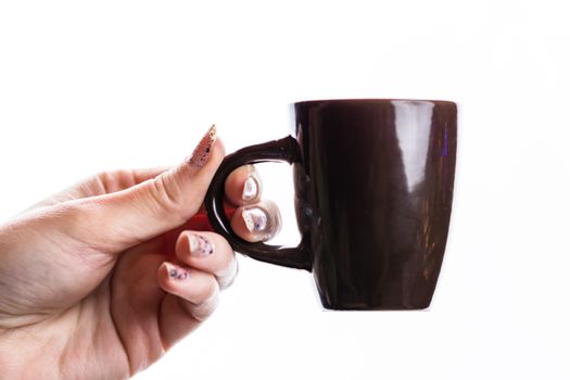 Woman hand holding a cup isolated on white background.