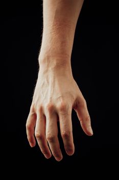 male hand, isolated on black