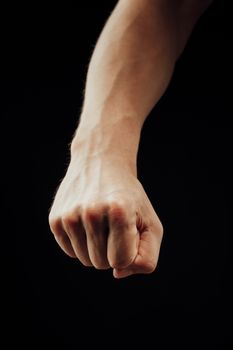 male fist, isolated on black