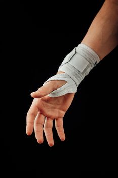 wrist and hand orthotics support for carpal tunnel syndrome healing, isolated on black