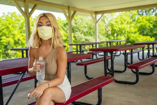 A gorgeous young blonde model enjoys a day outdoors while maintaining a safe distance from others during the Covid-19 pandemic