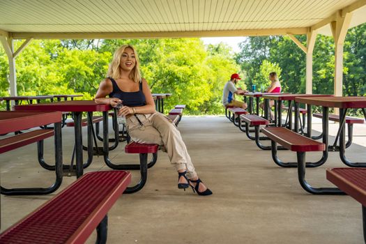 A gorgeous young blonde model enjoys a day outdoors while maintaining a safe distance from others during the Covid-19 pandemic