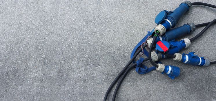 Electric wires line for video production on the concrete floor and top view angle.