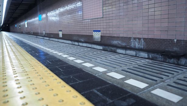 Old and dirty train platform or underground subway station in Osaka city Japan.