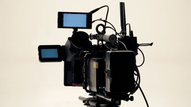 4K high defination video camera with tripod shooting in studio production and no people.