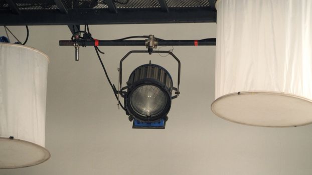 Big production spot light equipment in studio for video or film movie shooting and low angle view.