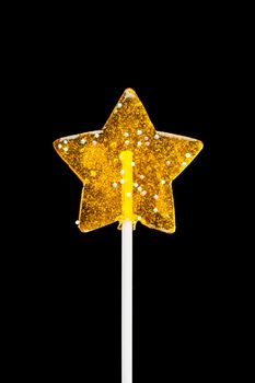 yellow star candy, isolated on black