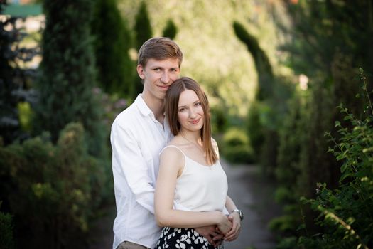 The young couple walking in the park