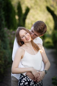 The young couple walking in the park