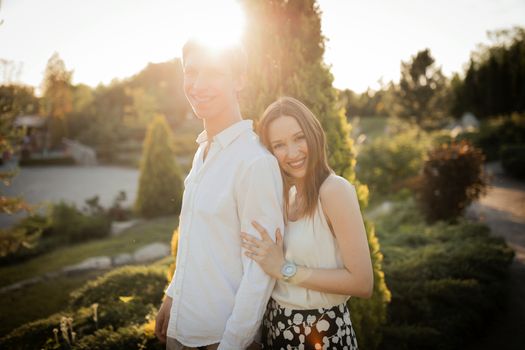 The young couple walking in the park