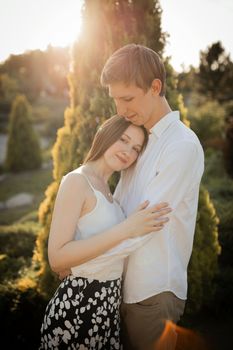 The young couple walking in the park