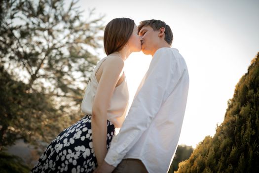 The young couple walking in the park