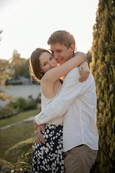 The young couple walking in the park