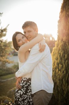 The young couple walking in the park