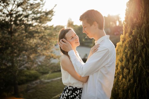 The young couple walking in the park