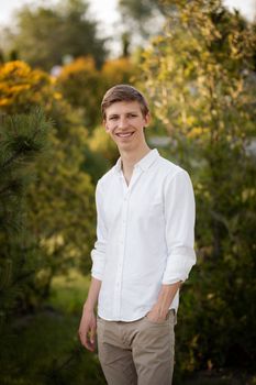 Young blonde man. Man outside. Outside on nature