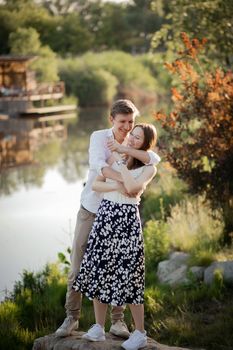 The young couple walking in the park