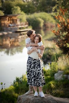 The young couple walking in the park