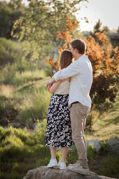 The young couple walking in the park