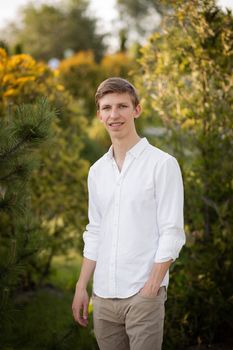 Young blonde man. Man outside. Outside on nature