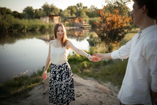 The young couple walking in the park