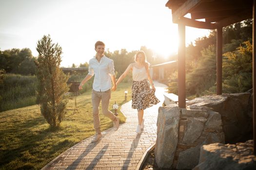 The young couple walking in the park