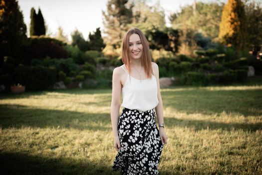 Beautiful girl outside. In the park. On nature