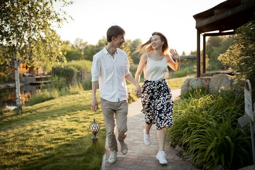 The young couple walking in the park