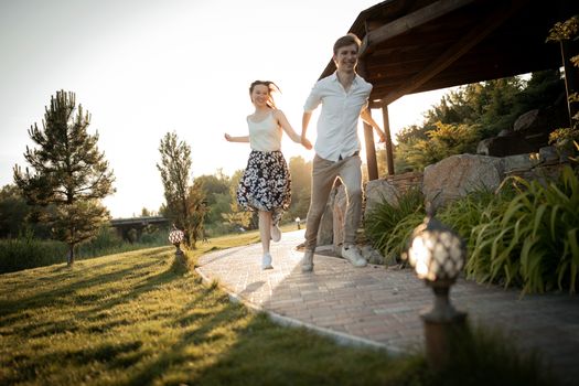 The young couple walking in the park