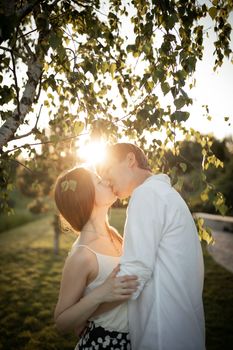 The young couple walking in the park