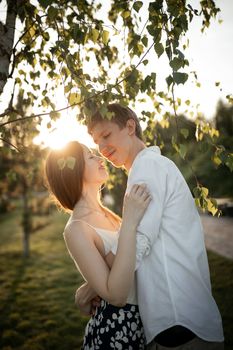 The young couple walking in the park