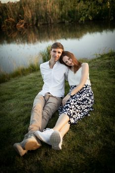 The young couple walking in the park