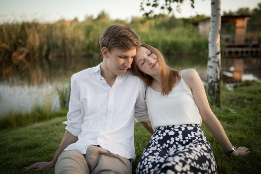 The young couple walking in the park