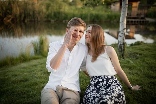 The young couple walking in the park