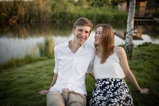 The young couple walking in the park