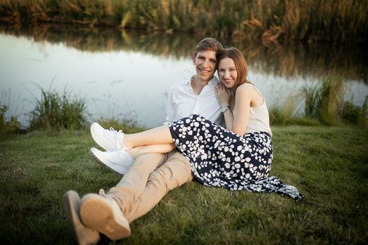 The young couple walking in the park