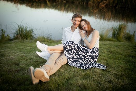 The young couple walking in the park