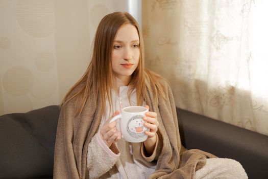 girl with a cup of coffee	or tea