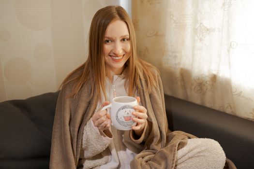 girl with a cup of coffee	or tea