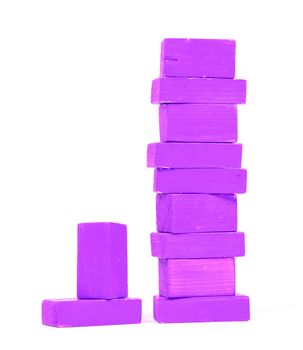 Vintage purple building blocks isolated on white background