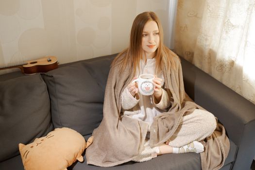 girl with a cup of coffee	or tea