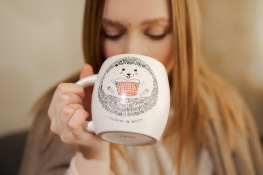 girl with a cup of coffee	or tea