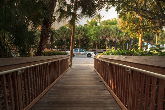 July 26, 2020 – Naples, Florida: Collier County Sheriff car parked in front of the entry of Vanderbilt Beach in Naples, Florida.