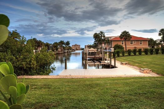 Sunrise over a Waterway leading to the Ocean near Vanderbilt Beach in Naples, Florida.