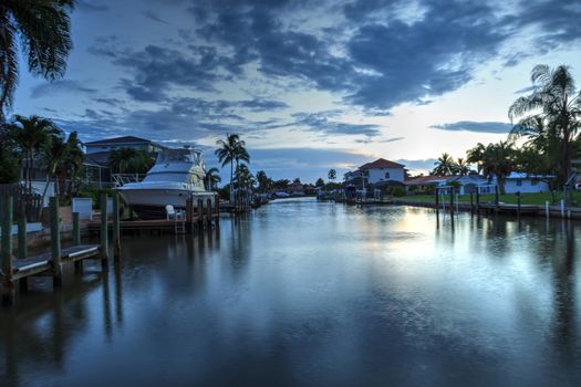 Sunrise over a Waterway leading to the Ocean near Vanderbilt Beach in Naples, Florida.