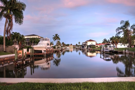 Sunrise over a Waterway leading to the Ocean near Vanderbilt Beach in Naples, Florida.