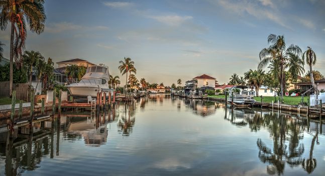 Sunrise over a Waterway leading to the Ocean near Vanderbilt Beach in Naples, Florida.